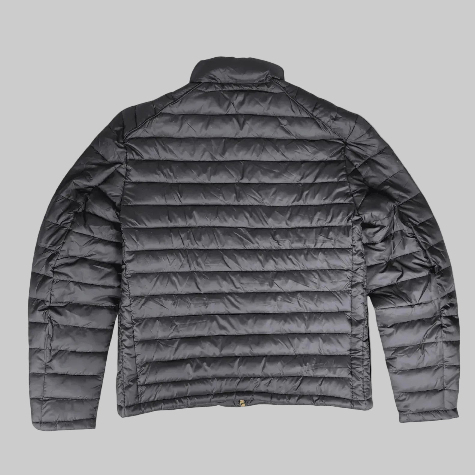 A dark gray quilted puffer jacket shown from the back, featuring horizontal stitching and a stand-up collar, photographed against a solid black background.