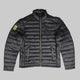 A dark gray quilted puffer jacket with a high collar, front zipper, and two zippered hand pockets. A bright neon yellow-green shield logo is visible on the left sleeve.