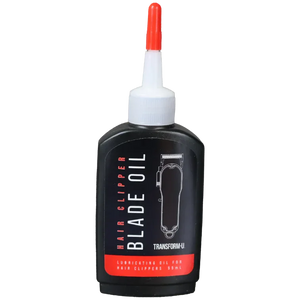 Hair clipper blade oil bottle with black label and red cap on transparent background