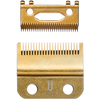 Two gold-colored hair clipper blades on a white background