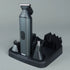 Gray grooming tool with attachments on a gray background