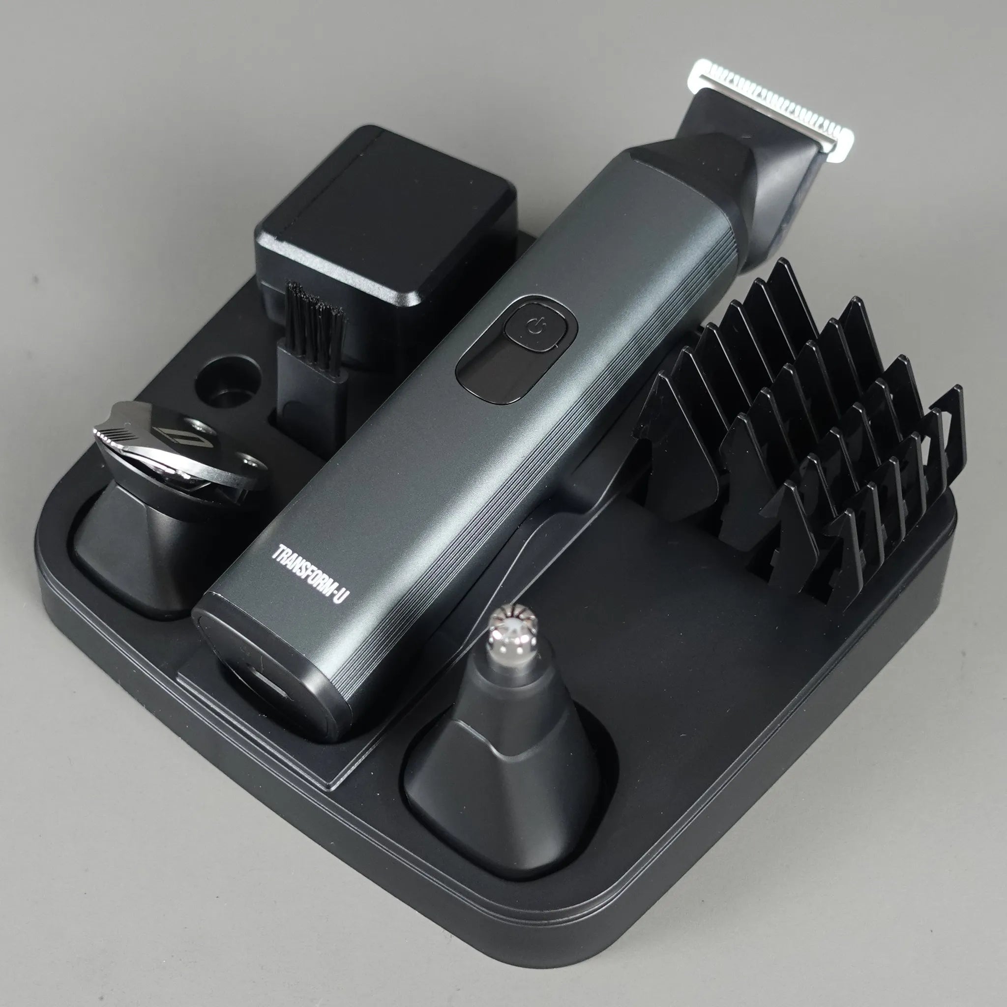 Hair trimmer set with attachments on a gray background