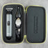 Hair trimming kitwith trimmer, ear cleaner, and USB cable in a black carrying case on a gray background.