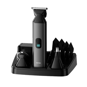 Black trimmer tool with attachments on a transparent background