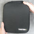 Black carrying case with 'TRANSFORM-U' branding held by a person on a light gray background