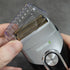 Close-up of a shaver with 'Transform-U' branding held by a person.