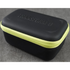 Black carrying case with green zipper on a gray background