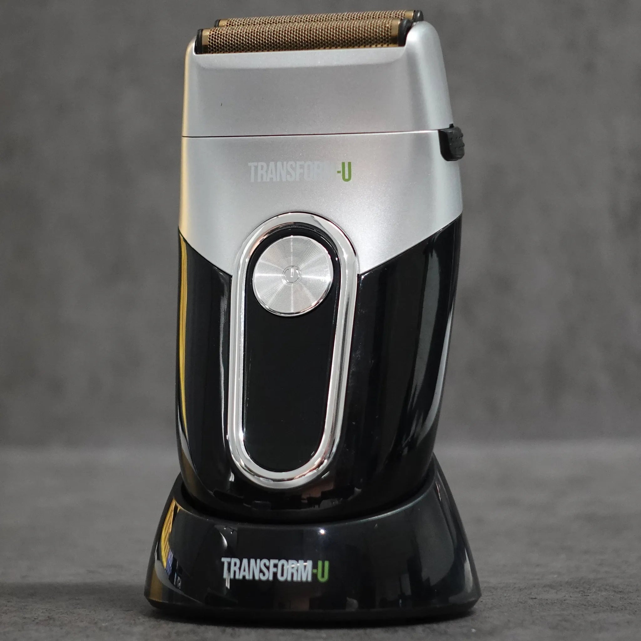 Electric shaver with 'Transform-U' branding on a gray background