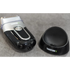 Electric shaver and charging stand on a gray surface